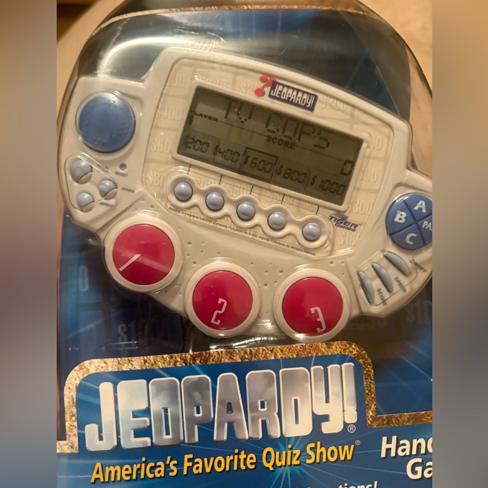 Jeopardy Handheld Game with Blue and Pink Buttons